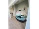 Cozy outdoor porch with lounging daybed, decorative pillows, and stylish decor perfect for relaxation at 3009 Ridgevale Cir, Valrico, FL 33596