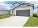 Beautifully landscaped home boasting a well-maintained lawn and neutral color palette at 3550 Moscato Dr, Brooksville, FL 34602