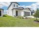 Charming home featuring a manicured lawn and inviting front entrance at 3550 Moscato Dr, Brooksville, FL 34602