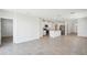 Open-concept living area featuring modern tile flooring and stainless steel appliances at 3550 Moscato Dr, Brooksville, FL 34602