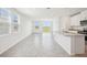 Bright and airy living room showcasing an open floor plan and tile floors at 3550 Moscato Dr, Brooksville, FL 34602