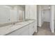 Bathroom with double sink vanity, granite countertops, and a walk-in shower at 3921 Radiant Mountain Dr, Plant City, FL 33565