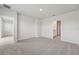Spacious bedroom with neutral carpet and access to an ensuite bathroom and walk-in closet at 3921 Radiant Mountain Dr, Plant City, FL 33565