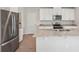 Modern kitchen with stainless steel appliances, granite countertops, and white cabinets at 3921 Radiant Mountain Dr, Plant City, FL 33565