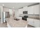 Modern kitchen with stainless steel appliances, granite countertops, and white cabinets at 3921 Radiant Mountain Dr, Plant City, FL 33565