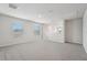 Well-lit loft featuring multiple windows offering natural light and plush carpeting at 3921 Radiant Mountain Dr, Plant City, FL 33565