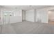 Bright and airy loft area with neutral carpet, perfect for flexible living space at 3921 Radiant Mountain Dr, Plant City, FL 33565