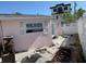 Backyard with a privacy fence, patio, and an architectural style that blends well with the neighborhood at 365 145Th E Ave, Madeira Beach, FL 33708