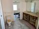 Bathroom featuring a dual sink vanity and separate toilet area at 365 145Th E Ave, Madeira Beach, FL 33708
