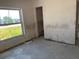 Empty bedroom with natural light from a double window at 365 145Th E Ave, Madeira Beach, FL 33708