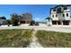 Modern two-story home with a spacious two-car garage and beautifully paved driveway near the water at 365 145Th E Ave, Madeira Beach, FL 33708