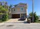 Modern two-story home with a spacious two-car garage and beautifully paved driveway near the water at 365 145Th E Ave, Madeira Beach, FL 33708