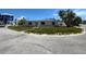 Charming single-story home featuring a classic design with a well-manicured lawn at 365 145Th E Ave, Madeira Beach, FL 33708
