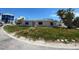 Charming single-story home featuring a classic design with a well-manicured lawn at 365 145Th E Ave, Madeira Beach, FL 33708