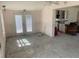 Bare living room showing open floor plan with french doors and a ceiling fan at 365 145Th E Ave, Madeira Beach, FL 33708