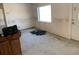 Bare room featuring a window, an exterior door, damaged walls, and ceiling fan at 365 145Th E Ave, Madeira Beach, FL 33708