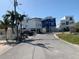 Street featuring modern homes with ample parking and vibrant landscaping, showcasing a friendly neighborhood at 365 145Th E Ave, Madeira Beach, FL 33708