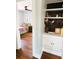 View of bedroom showing built in shelves and entry into the room with hardwood floors at 420 61St S Ave, St Petersburg, FL 33705