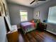 Bedroom featuring natural light, hardwood floors, and comfortable furnishings, creating a peaceful and inviting space at 420 61St S Ave, St Petersburg, FL 33705