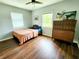 Bedroom with hardwood floors, natural light, and a comfortable bed at 420 61St S Ave, St Petersburg, FL 33705