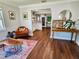 Inviting living room features hardwood floors, bright light, and seamless open floor plan to kitchen at 420 61St S Ave, St Petersburg, FL 33705