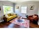 Cozy living room with large windows, hardwood floors, and bright décor, perfect for relaxing or entertaining at 420 61St S Ave, St Petersburg, FL 33705