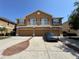 Three-unit townhome with brown exterior, balconies, and three garages at 7544 Red Mill Cir, New Port Richey, FL 34653