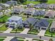 A well-kept residential neighborhood with neatly arranged houses and green lawns, and access to amenities at 10516 Tranquil Meadow Loop, Riverview, FL 33569