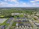 Expansive aerial view shows home located in a vibrant community with easy access to amenities and green spaces at 10516 Tranquil Meadow Loop, Riverview, FL 33569