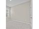 Bright bedroom with carpeted flooring, light-colored walls, and plantation shutters at 10516 Tranquil Meadow Loop, Riverview, FL 33569