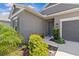 Charming home with a well-manicured lawn, beautiful landscaping, and a neutral exterior at 10516 Tranquil Meadow Loop, Riverview, FL 33569