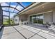 Spacious covered patio features a built-in kitchen area and comfortable seating at 10516 Tranquil Meadow Loop, Riverview, FL 33569