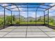 Screened-in patio with ample space and views of the backyard, perfect for outdoor enjoyment at 10516 Tranquil Meadow Loop, Riverview, FL 33569