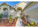 Inviting home entrance with beautiful landscaping leading to the front door at 4305 Balmoral Ct, Wesley Chapel, FL 33543