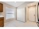 Bright breakfast nook featuring white cabinetry, a closet, and an exterior door at 4305 Balmoral Ct, Wesley Chapel, FL 33543
