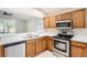 Stylish kitchen showcasing stainless steel appliances and seamless access to the Gathering room at 4305 Balmoral Ct, Wesley Chapel, FL 33543