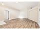 Bright living room showcasing vaulted ceilings and wood-look flooring throughout at 4305 Balmoral Ct, Wesley Chapel, FL 33543