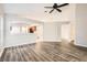 Open floor plan showcasing the living room's new floors and connection to the kitchen at 4305 Balmoral Ct, Wesley Chapel, FL 33543