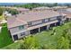 Aerial view shows the spacious backyard and screened-in patio of this lovely townhouse-style home at 11632 Castine St, New Port Richey, FL 34654