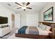 Staged bedroom featuring carpet, ceiling fan, a closet with double doors and artwork at 11632 Castine St, New Port Richey, FL 34654