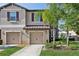 Charming townhome featuring a two-car garage, manicured lawn, and a beautifully landscaped front yard at 11632 Castine St, New Port Richey, FL 34654