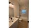Modern bathroom features a sleek vanity, toilet, and shower/tub combination with stylish tiling at 353 Warrington Blvd, Port Charlotte, FL 33954