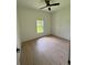 Bright bedroom with hardwood floors and a window providing ample natural light at 353 Warrington Blvd, Port Charlotte, FL 33954