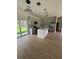Stylish kitchen featuring a center island, pendant lighting, stainless steel appliances, and modern cabinetry at 353 Warrington Blvd, Port Charlotte, FL 33954
