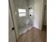 New bathroom showcases a stylish walk-in shower with marble-like tiling and a window at 353 Warrington Blvd, Port Charlotte, FL 33954