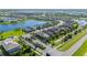 Beautiful aerial view of a Primary-planned community featuring lush landscaping, numerous homes, and scenic ponds at 4861 Antrim Dr, Sarasota, FL 34240