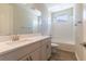 Bright bathroom featuring vanity, toilet, tub and shower combo at 4861 Antrim Dr, Sarasota, FL 34240