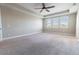 Spacious bedroom with neutral carpet, ceiling fan and bright natural light at 4861 Antrim Dr, Sarasota, FL 34240