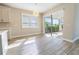 The dining area overlooks the screened-in lanai and backyard, with a chandelier at 4861 Antrim Dr, Sarasota, FL 34240