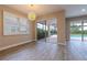 Bright dining area features large windows and access to the screened lanai and pool at 4861 Antrim Dr, Sarasota, FL 34240
